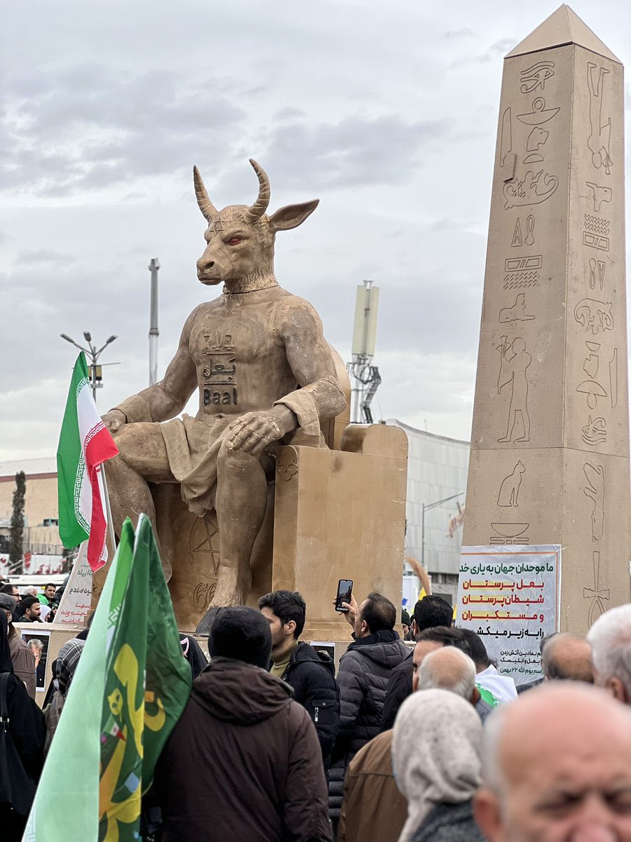 Iranians Burn Statue of Baal During Revolution Anniversary Demonstrations